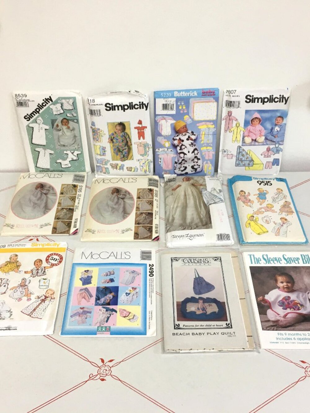 Lot #10 - Collection of 12 Baby / Infant Sewing Patterns
